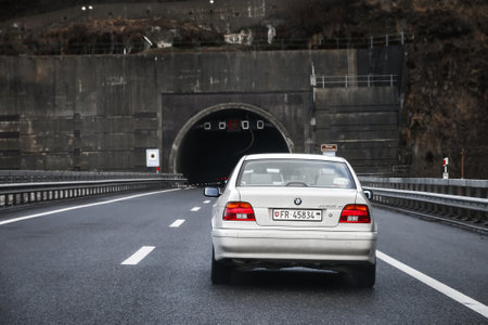 Vaud, Switzerland - March 13, 2019: White motor car BMW 525d (E39) at the interurban road.のeditorial素材