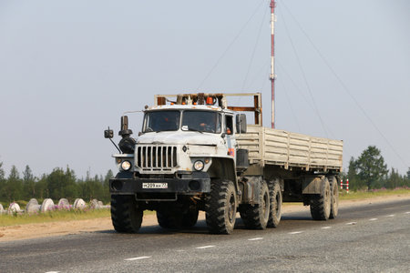 Novyy Urengoy, Russia - July 20, 2019: Offroad semitrailer truck Ural 44202 at the interurban road.