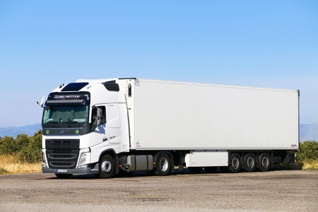 Aragon, Spain - September 9, 2019: White semi-trailer truck Volvo FH12.500 at the interurban road.のeditorial素材