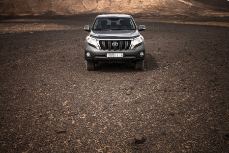 Taouz, Morocco - September 26, 2019: Offroad car Toyota Land Cruiser Prado 150 in the Sahara desert.