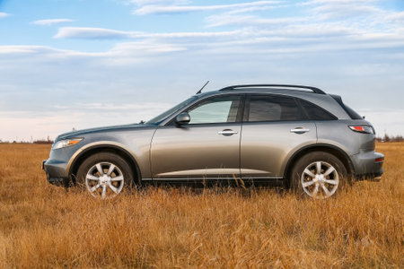 Novyy Urengoy, Russia - May 19, 2020: Luxury crossover Infiniti FX35 in the grassland.のeditorial素材