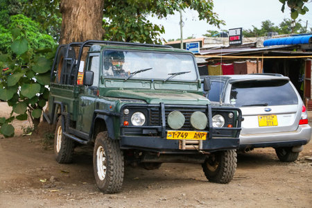 Arusha, Tanzania - February 6, 2021: Old pickup truck Land Rover Defender in the city street.のeditorial素材