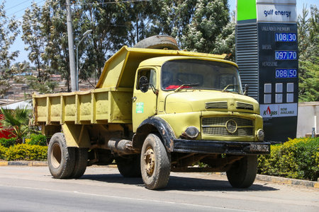 Narok County, Kenya - January 28, 2021: Old dump truck Mercedes-Benz L-series in the city street.のeditorial素材
