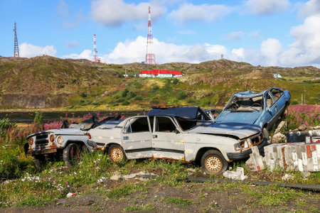 Teriberka, Russia - August 17, 2020: Old cars GAZ 3110 Volga and UAZ 3151 at the metal scrap yard.のeditorial素材