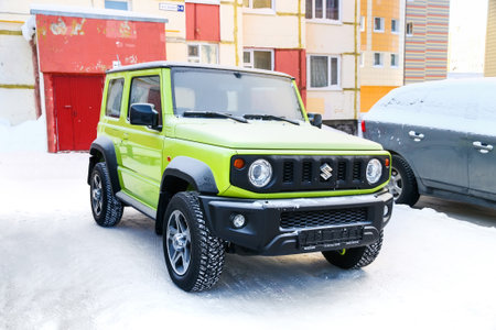 Novyy Urengoy, Russia - February 28, 2021: Small offroad car Suzuki Jimny in the city street.