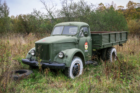 Sim, Russia - September 26, 2021: Green Soviet truck GAZ 51 at a countryside.のeditorial素材