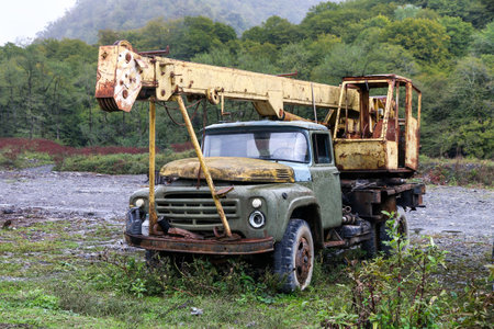Tusheti, Georgia - October 6, 2021: Abandoned Soviet construction crane ZiL 130 in the Caucasus mountains.のeditorial素材
