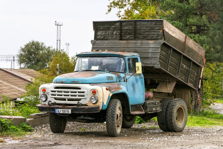 Pshaveli, Georgia - October 6, 2021: Old construction dump truck ZiL MMZ 4502 in a city street.のeditorial素材