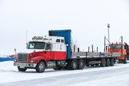 Novyy Urengoy, Russia - March 26, 2021: Semitrailer truck International 9200i Eagle at an intercity road.のeditorial素材