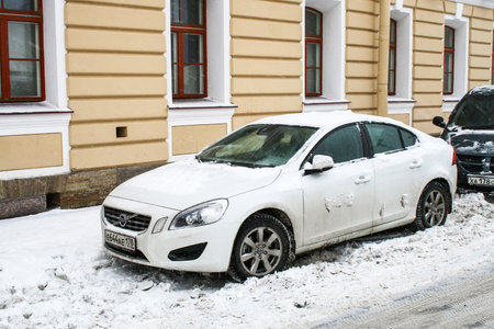Saint Petersburg, Russia - February 2, 2011: White saloon car Volvo S60 in a city street.のeditorial素材