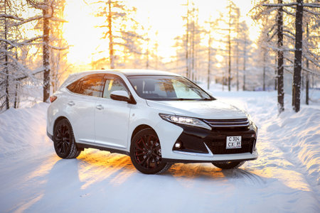Novyy Urengoy, Russia - February 10, 2022: Japanese crossover Toyota Harrier in a winter forest...