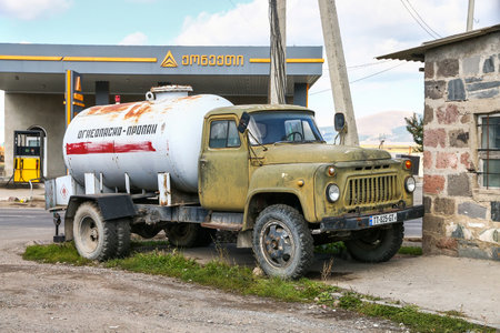 Akhalkalaki, Georgia - October 8, 2021: Old propane carrier GAZ 52 in a city street.のeditorial素材