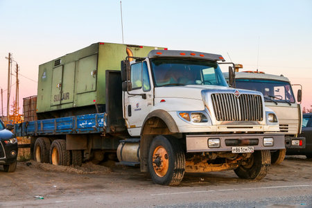 Novyy Urengoy, Russia - September 24, 2020: American flatbed lorry International 7600 in a city street.のeditorial素材