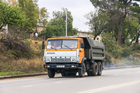 Kakheti, Georgia - October 9, 2021: Old dump truck Kamaz 5511 at an intercity road.のeditorial素材