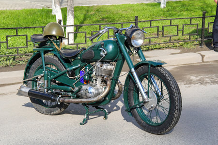 Ekaterinburg, Russia - May 9, 2012: Green retro motorcycle Izh-49 takes part in the retro car show of the Victory Day.のeditorial素材