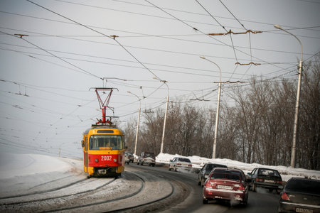 Ufa, Russia - February 17, 2008: Bright red tramway Tatra T3 in the city street.のeditorial素材