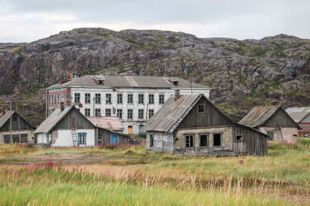 Abandoned school and living houses in Teriberka, Russiaの写真素材