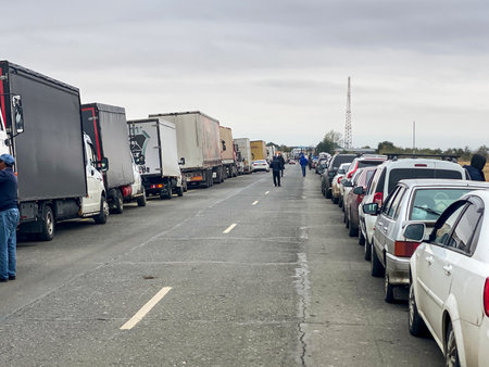 Orenburg Region, Russia - September 28, 2022: Endless queue of cars carrying people escaping from Russia to Kazakhstan because of the war.のeditorial素材