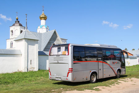 Suzdal, Russia - August 23, 2011: Small touristic coach bus Higer KLQ6885Q near the white church.のeditorial素材