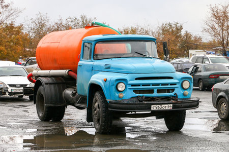 Atyrau, Kazakhstan - October 21, 2022: Old sanitary truck ZiL-130 in the city street.のeditorial素材