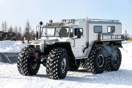 Novyy Urengoy, Russia - March 18, 2023: Heavy offroad vehicle Olimp in the city street.のeditorial素材