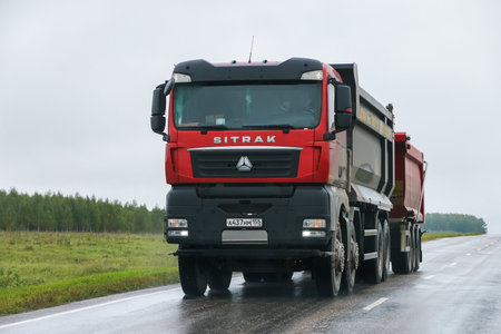 Chelyabinsk region, Russia - September 5, 2023: Chinese dump truck CNHTC Sitrak C7H at an interurban road.のeditorial素材