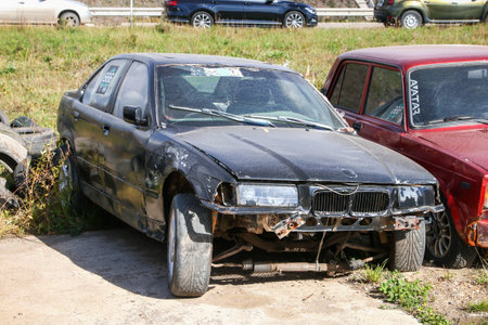 Ufa, Russia - September 23, 2023: Broken drift car BMW 3-series (E36) in the city street.のeditorial素材