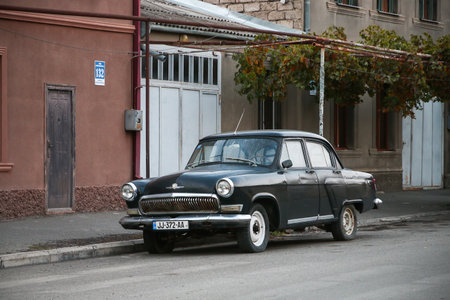 Gori, Georgia - October 7, 2021: Classic Soviet luxury car GAZ-21 Volga in the city street.のeditorial素材