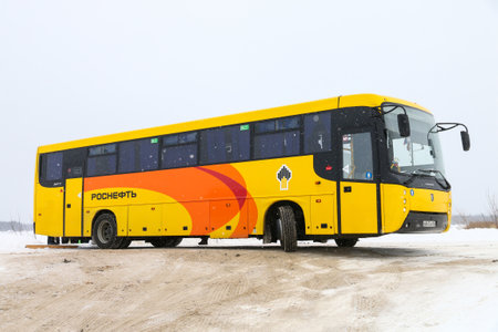 Tarko-Sale, Russia - March 2, 2024: Rosneft oil company coach bus Nefaz-5299 in the city street.