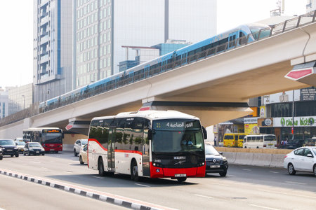 Dubai, UAE - July 3, 2024: Urban bus Sunsundegui SB3 LE in the city street near the Dubai Metro...