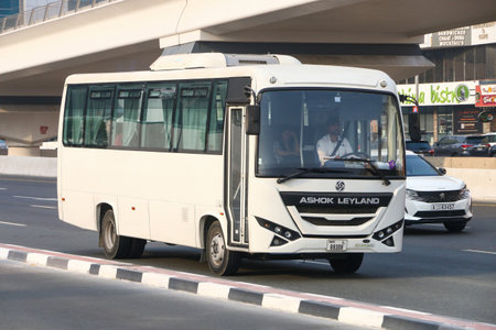 Dubai, UAE - July 3, 2024: White suburban bus Ashok Leyland Oyster in the city street.