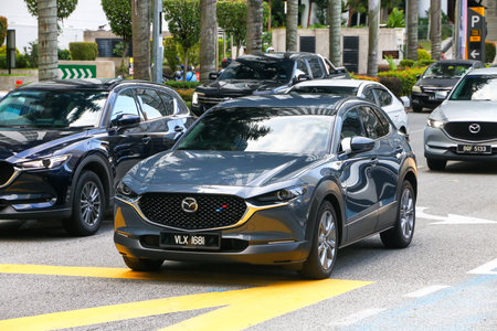 Kuala Lumpur, Malaysia - February 20, 2025: Grey subcompact crossover car Mazda CX-30 (DM) in the...