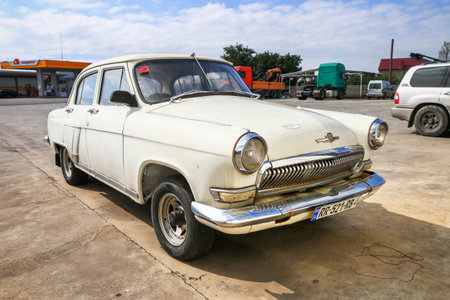 Kutaisi, Georgia - September 25, 2025: Old Soviet luxury saloon car GAZ-21 Volga at the interurban road.のeditorial素材