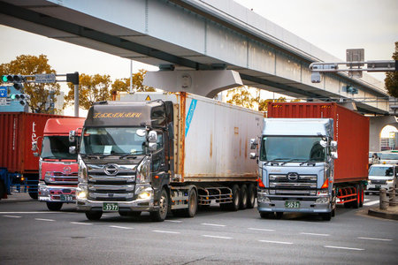 Tokyo, Japan - February 26, 2026: Group of the semi-trailer container trucks Hino Profia at the city...