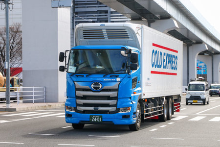 Tokyo, Japan - March 4, 2026: Blue refrigerator truck Hino Profia at the city street.