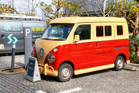 Tokyo, Japan - March 4, 2026: Classic Volkswagen Type 2 T1 stylized kei van Suzuki Every (DA52) at...
