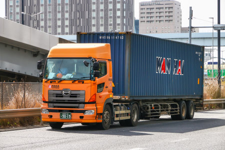 Tokyo, Japan - February 27, 2026: Semi-trailer containter truck Hino Profia at the interurban road.