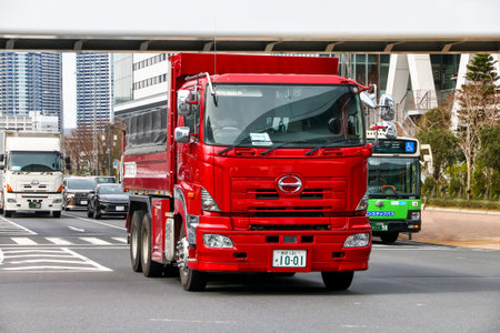 Tokyo, Japan - February 27, 2026: Red dump truck Hino Profia at the city street.