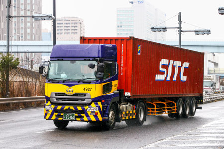 Tokyo, Japan - March 3, 2026: Semi-trailer container truck UD Quon at the intecity road.