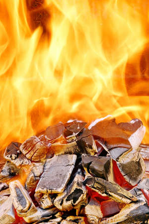 The burning fire in BBQ. Background and Texture with space for text or image.