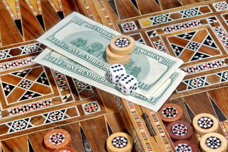 Backgammon Board and two hundred dollar as the prize for winning the game