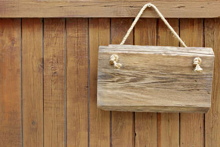 Wooden Sign Board and timber wall backgroundの写真素材