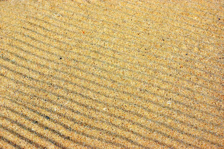 Beach sand background and texture with space for text or imageの写真素材