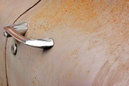 Junk car door with chrome handle. Background with copy space.の写真素材