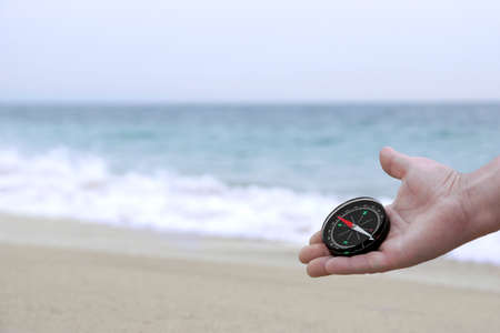Male hand with Compass. Background with copy spaceの写真素材
