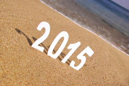 2015 New Year numbers on the sea beach. Background and Texture for text or image