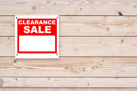 CLEARANCE SALE Red White Sign on Timber Wall Backgroundの写真素材