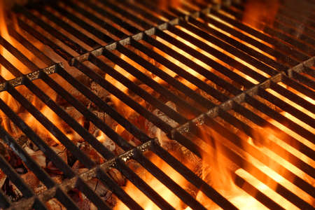 BBQ Grill with Glowing Coals and Bright Flamesの写真素材