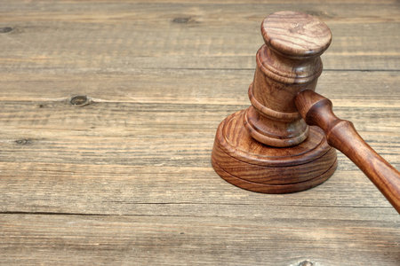 Judges Gavel and Soundboard Close-up on Grunge Wooden Tableの写真素材