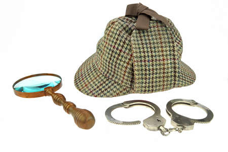 Detective Hat, Retro Magnifier and Real Handcuffs Isolated on White Backgroundの写真素材